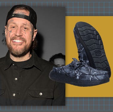 Fashionable shoes showcased in a promotional context with a blurred background figure.