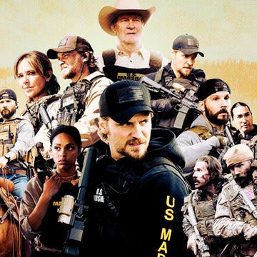Group of law enforcement agents and a horse, set against a mountainous background.