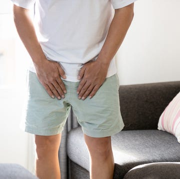 asian middle aged man suffering from inguinal hernia,groin lymph node swollen,hernia pain,male patient holding crotch,groin strain,painful in testicle,illness problems,health care and medical concept