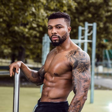man posing by outdoor gym