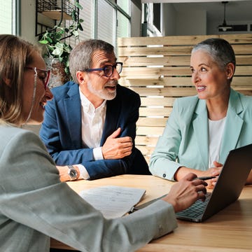 a financial advisor meeting with clients