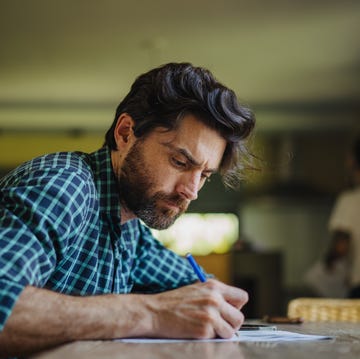 mature man filling in paperwork