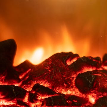 close up of burning wood in a fireplace.