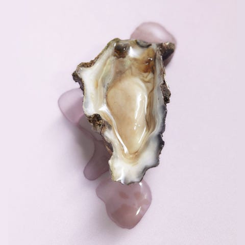 Open oyster representing oral sex on a vagina, cunnilingus