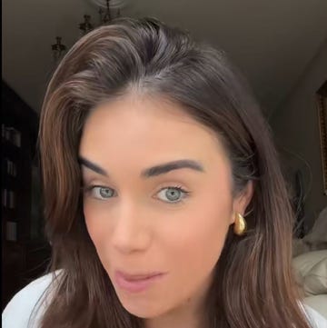 closeup of a person with styled hair and earrings
