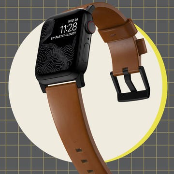 two smartwatches displayed side by side on a grid background