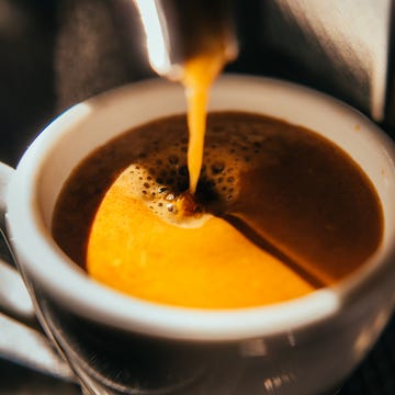 coffee machine pouring out espresso, close up