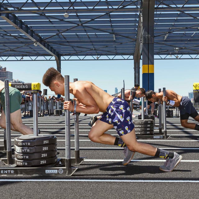 athlete competing in a Hyrox fitness event athlete competing in a Hyrox fitness event