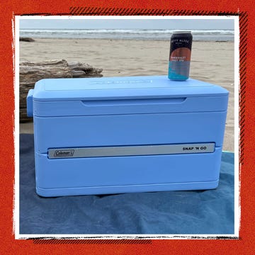 Portable blue cooler designed for easy transport and storage.