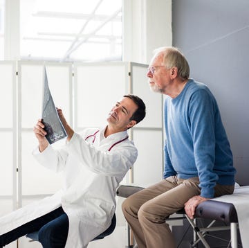 doctor discussing mrt image with patient in medical practice