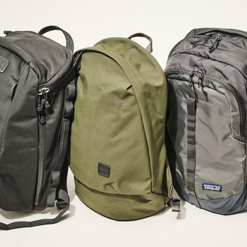 three backpacks of different designs and colors arranged closely