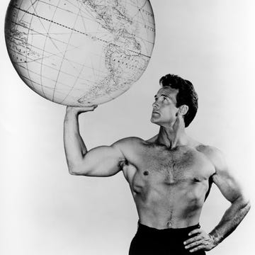 american bodybuilder and actor steve reeves (1926 2000) holding up a large globe, circa 1960. (photo by silver screen collection/getty images)