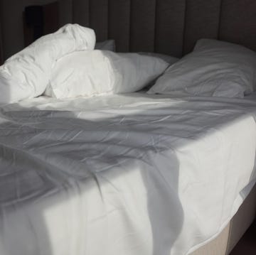 messy bed in early morning , messy bed after waking up .