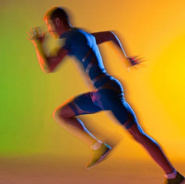 a runner in motion against a colorful backdrop