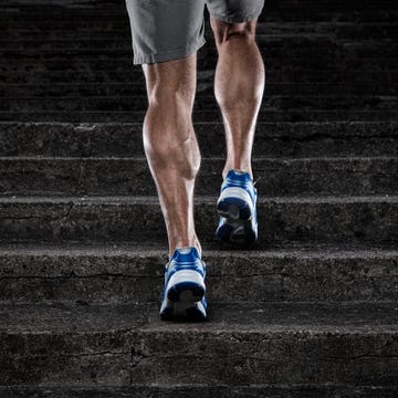 Practice close up of young man running up the stairs