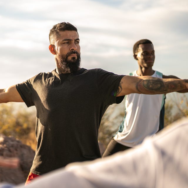 mature man during an yoga class outdoors