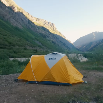 Campsite in a mountainous landscape with tents. Campsite in a mountainous landscape with tents.