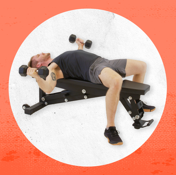 a man lying on a white circle with red text